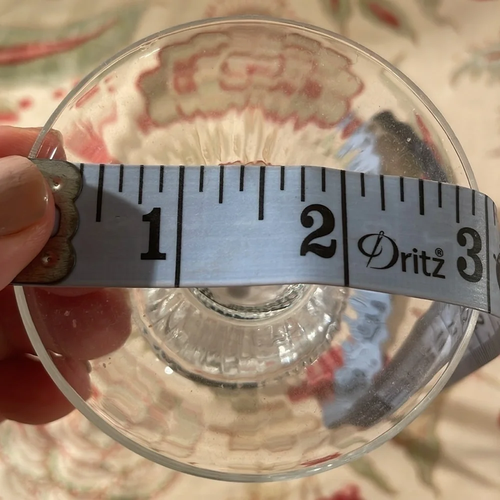 Elegant Handblown Twisted Stem Black Detail Cradling a Ribbed Candle Drip Plate